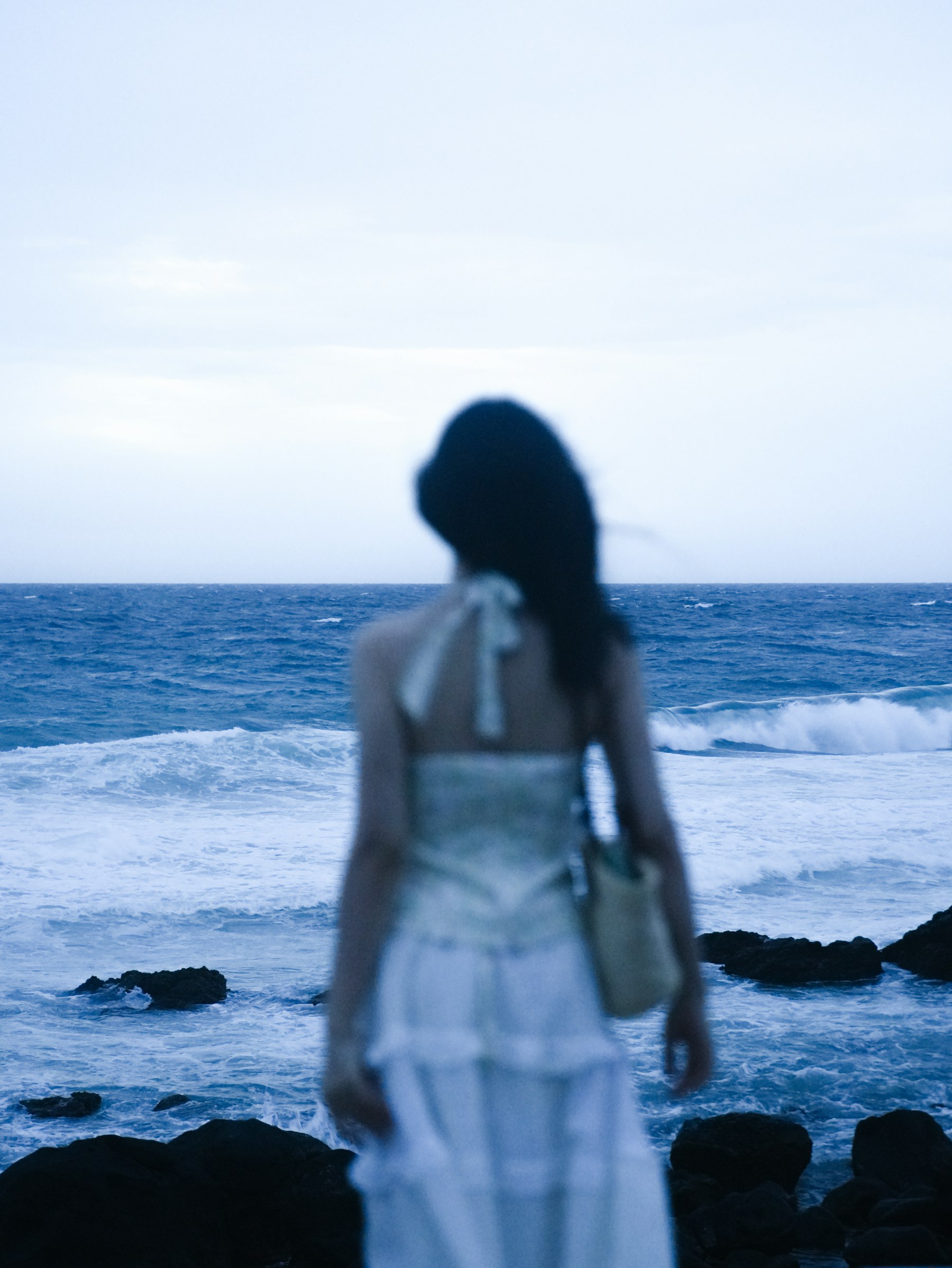 A visitor looking out to sea on Phu Quy Island