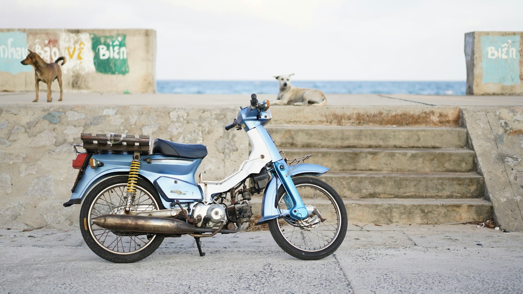 Motorbike parked on a coastal road on Phu Quy